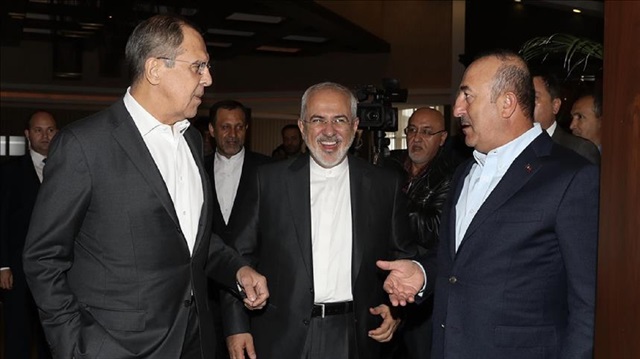 Foreign Affairs Minister of Turkey Mevlut Cavusoglu (R), Russian Foreign Minister Sergey Lavrov (L) and Iranian Foreign Minister Mohammad Javad Zarif (C) chat during their Trilateral Foreign Ministers' Meeting in Antalya, Turkey on November 19, 2017.