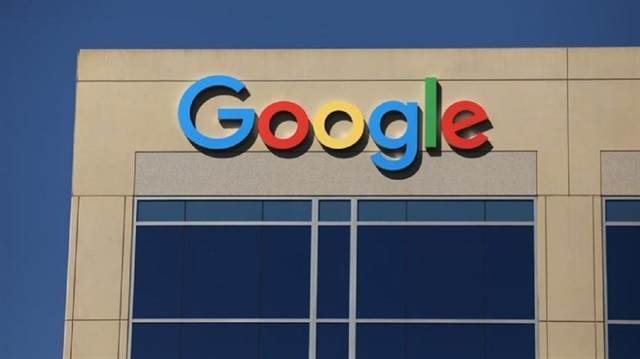 The Google logo is pictured atop an office building in Irvine, California