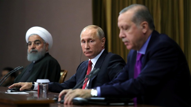 Iran's President Hassan Rouhani together with his counterparts Russia's Vladimir Putin and Turkey's Recep Tayyip Erdoğan attend a joint news conference following their meeting in Sochi, Russia November 22, 2017.