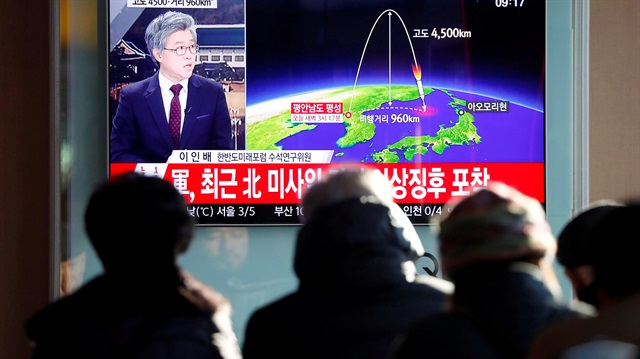 People watch a television broadcast of a news report on North Korea firing what appeared to be an intercontinental ballistic missile (ICBM) that landed close to Japan, in Seoul, South Korea.