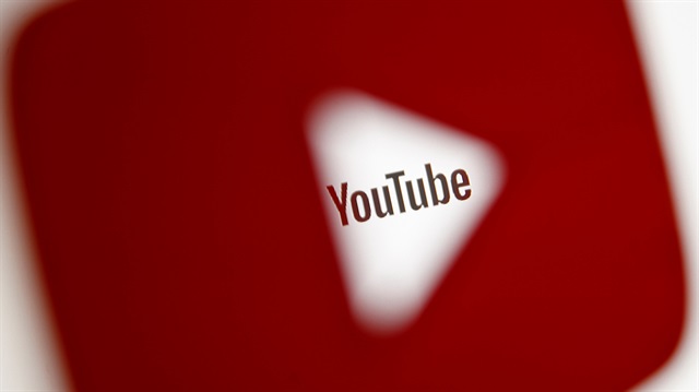 FILE PHOTO: A 3D-printed YouTube icon is seen in front of a displayed YouTube logo 