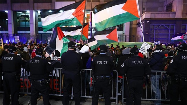 US security forces stand guard as protesters march, started from Federal Plaza, to Israeli Consulate General during a demonstration against the US President Donald Trump’s recognition of Jerusalem as Israel’s capital, in Chicago, United States