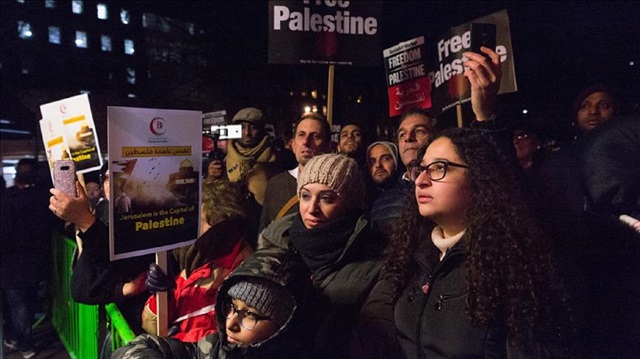 Demonstrators take part in a protest outside the US Embassy in London, England on December 08, 2017. The protest took place after US President Donald Trump formally recognised Jerusalem as the capital of Israel and said he would start the process of moving its embassy there