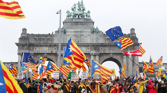 People take part in a pro-independence rally for Catalonia, in Brussels, Belgium.