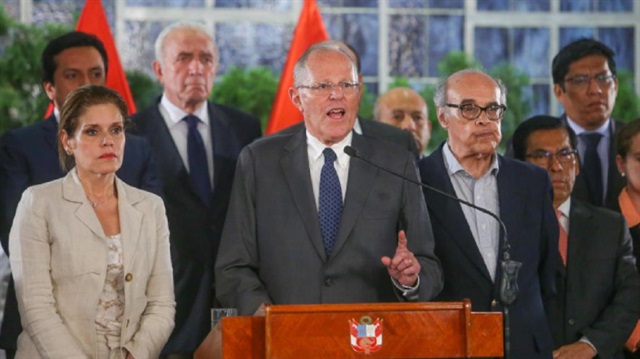 Peruvian President Pedro Pablo Kuczynski (C), flanked by vice-president Mercedes Araoz (L) and his cabinet, gives a speech at the Government Palace in Lima, Peru