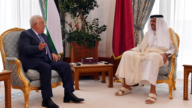 Qatar’s Emir Sheikh Tamim bin Hamad al-Thani meets with Palestinian President Mahmoud Abbas