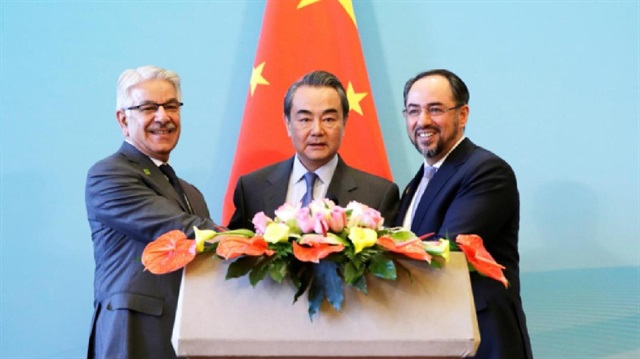 (L to R) Afghan Foreign Minister Salahuddin Rabbani, Chinese Foreign Minister Wang Yi and Pakistani Foreign Minister Khawaja Asif attend a joint news conference after the 1st China-Afghanistan-Pakistan Foreign Ministers' Dialogue in Beijing, China,