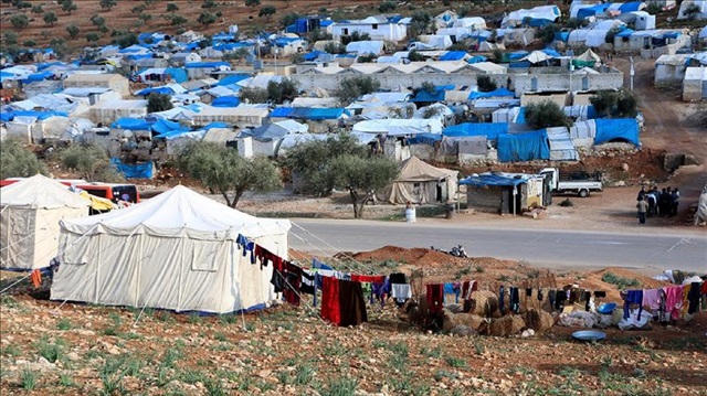 Syrian families are seen in Qah Village of Idlib, Syria near refugee camps that host thousands of war victims fled from their homeland due to ongoing civil war, 