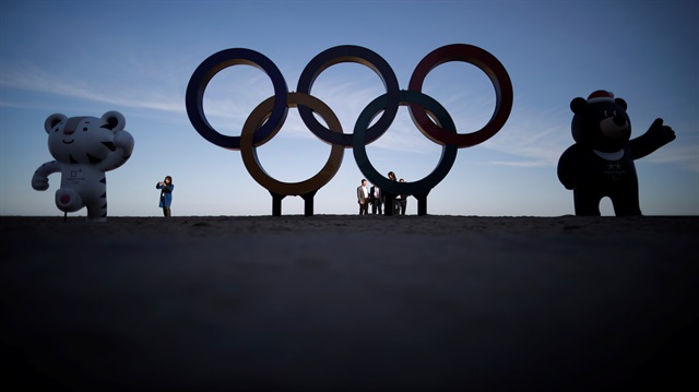 The 2018 PyeongChang Winter Olympics mascot Soohorang, Paralympics mascot Bandabi and the Olympic Rings are displayed at the Gyeongpodae beach in Gangneung, South Korea