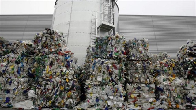 Plastic bottles to be recycled stand in bundles at the Closed Loop recycling plant in Dagenham, east London