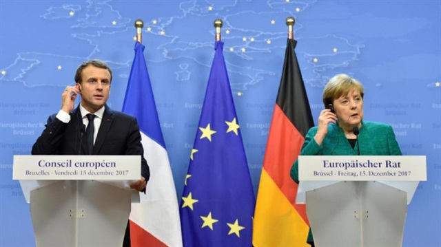 French President Emmanuel Macron and German Chancellor Angela Merkel give a joint news conference after the EU summit in Brussels, Belgium,