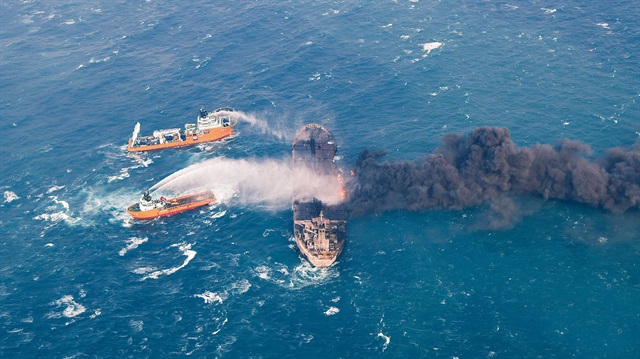 Rescue ships work to extinguish the fire on the Panama-registered Sanchi tanker carrying Iranian oil, which went ablaze after a collision with a Chinese freight ship in the East China Sea, in this January 10, 2018 picture provided by China's Ministry of Transport and released by China Daily.