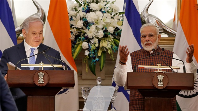 India's Prime Minister Modi speaks as his Israeli counterpart Netanyahu looks on during a signing of agreements ceremony at Hyderabad House in New Delhi
