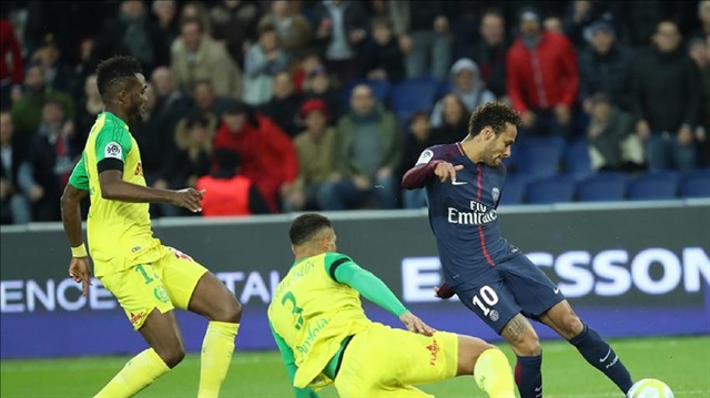 Neymar (R) of Paris Saint-Germain in action against Chidozie Awaziem (L) and Diego Carlos (C) of of Nantes during the French Ligue 1 football match between Paris Saint-Germain (PSG) and Nantes at the Parc des Princes Stadium in Paris, France on November 18, 2017.