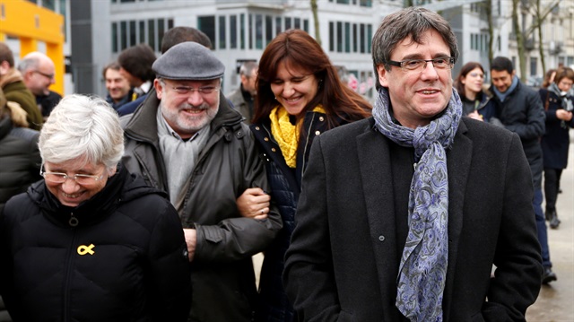 Former Catalan leader Puigdemont poses with members of his party 'Junts per Catalunya' parliament group in Brussels