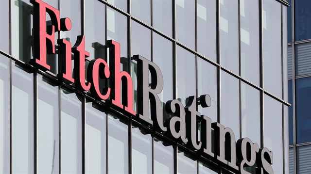  The Fitch Ratings logo is seen at their offices at Canary Wharf financial district 