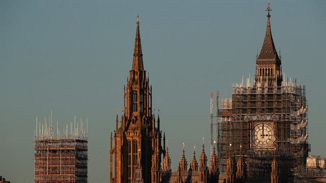The Big Ben clocktower and part of the Houses of Parliament are surrounded in scaffolding in London, Britain, December 28, 2017. REUTERS/Hannah McKay