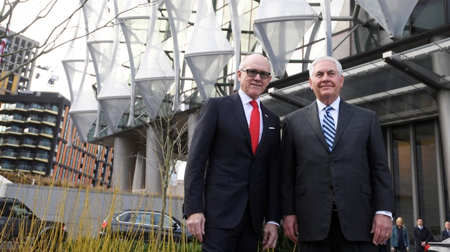 U.S. Secretary of State Rex Tillerson and Woody Johnson, U.S. ambassador to Britain stand outside the new U.S. embassy in London.