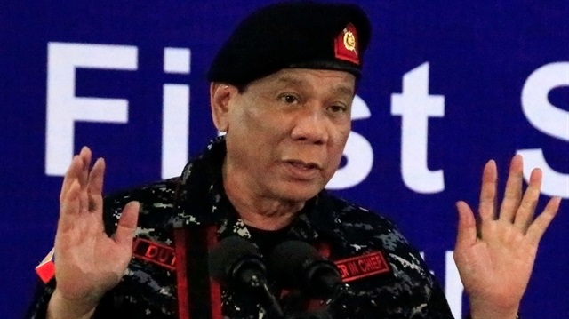 File Photo: Philippine President Rodrigo Duterte, wearing a military uniform, gestures as he delivers a speech during the 67th founding anniversary of the First Scout Ranger regiment in San Miguel town, Bulacan province, north of Manila