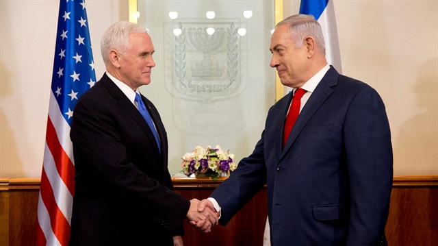 U.S. Vice President Mike Pence shakes hands with Israeli Prime Minister Benjamin Netanyahu during a meeting at the Prime Minister's office in Jerusalem
