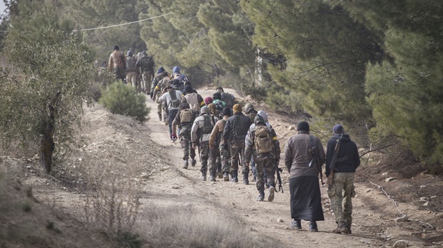 Members of Free Syrian Army (FSA), backed by Turkish army, are seen as they launch an operation against PYD/PKK in Afrin, as part of the "Operation Olive Branch", on January 22, 2018 in Azez region of Aleppo, Syria. 