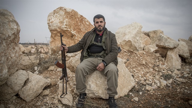 A Kurdish member of the Free Syrian Army (FSA) Ebu Usame poses for a photo as he stands guard in Azaz, Syria on January 21, 2018. FSA backed by Turkish army continue to move towards Afrin. 