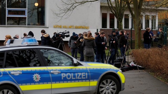 A police car is parked in front of the Kaehte Kollwitz comprehensive school in Luenen, Germany, January 23, 2018, where police investigated reports that one student attacked another.