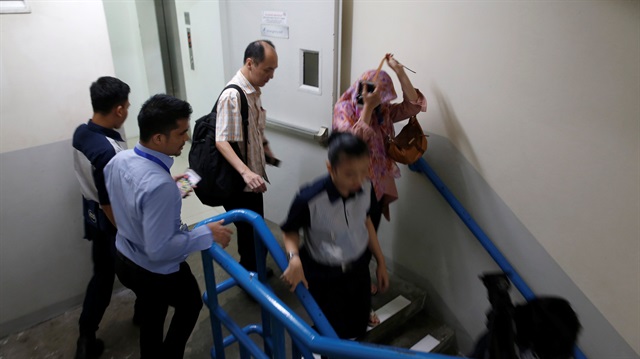 People run down the emergency stairs at The City Tower building as an earthquake hits Jakarta