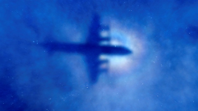 File Photo: The shadow of a Royal New Zealand Air Force (RNZAF) P3 Orion maritime search aircraft can be seen on low-level clouds as it flies over the southern Indian Ocean looking for missing Malaysian Airlines flight MH370 March 31, 2014. 
