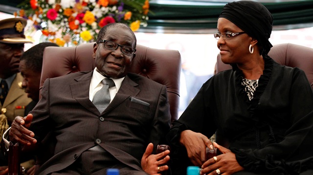File Photo: Zimbabwe's Ex-president Robert Mugabe speaking to his wife Grace Mugabe