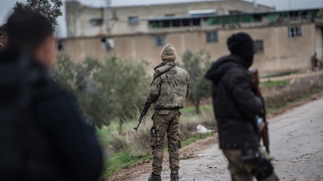 Members of Free Syrian Army (FSA), backed by Turkish Army, patrol a passage route, within the "Operation Olive Branch", launched in Syria's Afrin region, in Azez region of Aleppo, Syria on January 26, 2018. 