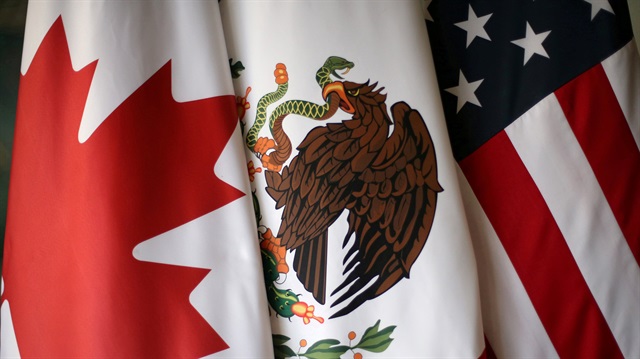 File Photo: Flags are pictured during the fifth round of NAFTA talks involving the United States, Mexico and Canada, in Mexico City, Mexico, November 19, 2017. REUTERS/Edgard Garrido/File Photo
