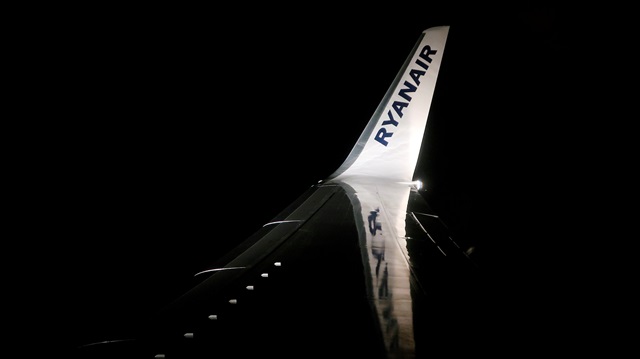 File Photo: A Ryanair logo is seen on a wing of a passenger aircraft travelling from Madrid International Airport to Bergamo Airport, Italy