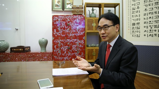 Head of the Korean Cultural Center Dong Woo Cho poses for a photo during an exclusive interview in Ankara, Turkey on February 4, 2018.