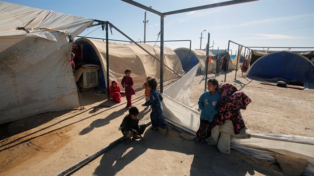 Displaced Iraqi children are seen at the Amriyat al Fallujah camp in Anbar Province, Iraq January 3, 2018. 