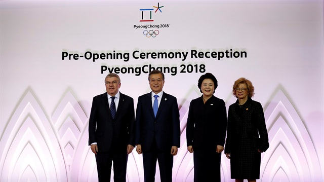 File Photo: South Korean President Moon Jae-in, his wife Kim Jung-Suk, IOC President Thomas Bach and his wife Claudia pose for photographs during the Olympic Opening ceremony reception in Pyeongchang