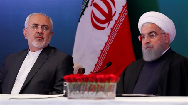Iranian President Hassan Rouhani (R) and Foreign Minister Mohammad Javad Zarif (L)