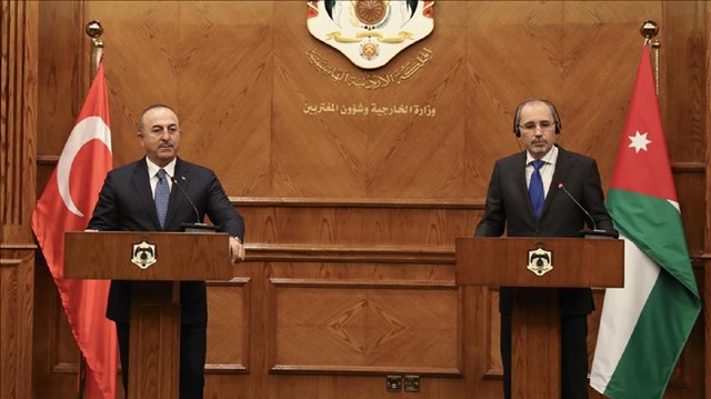 Minister of Foreign Affairs of Turkey, Mevlut Cavusoglu (L) and Minister of Foreign Affairs of Jordan Ayman Al Safadi (R) hold a joint press conference in Amman, Jordan on February 19, 2018.