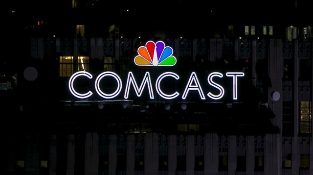 File Photo: The NBC and Comcast logo are displayed on top of 30 Rockefeller Plaza, formerly known as the GE building, in midtown Manhattan in New York