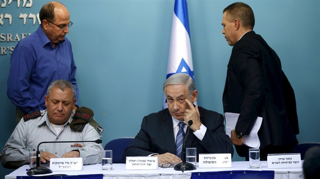 File Photo: Israel's Prime Minister Netanyahu gestures after he spoke during a news joint conference with Defence Minister Yaalon, Army Chief of Staff Lieutenant-General Eisenkot and Public Security Minister Erdan in Jerusalem