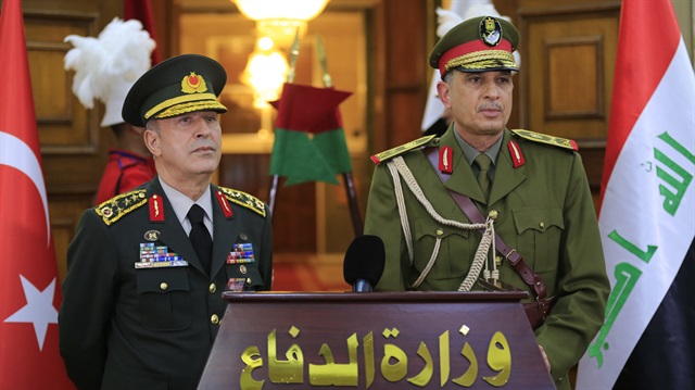 Chief of General Staff of Turkish Armed Forces Gen. Hulusi Akar (L) and Iraqi Army Chief of Staff Gen. Othman al-Ghanimi (R) hold joint press conference after their meeting in Baghdad, Iraq on March 01, 2018