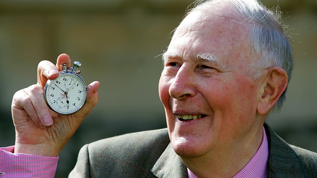 File Photo: Sir Roger Bannister, who ran the first sub-four-minute mile in 1954, holds the stop watch used by Harold Abrahams to time the race during 50th anniversary celebrations at Pembroke College, Oxford