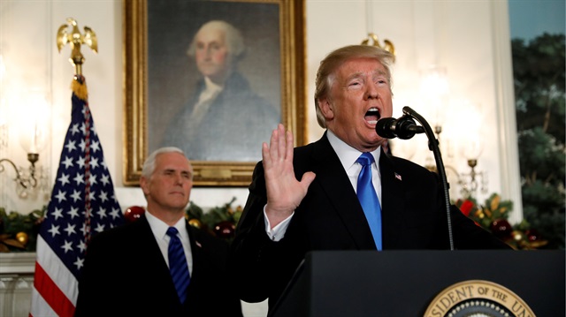 With Vice Pence Mike Pence looking on, U.S. President Donald Trump gives a statement on Jerusalem, during which he recognized Jerusalem as the capital of Israel, in the Diplomatic Reception Room of the White House in Washington, U.S., December 6, 2017.