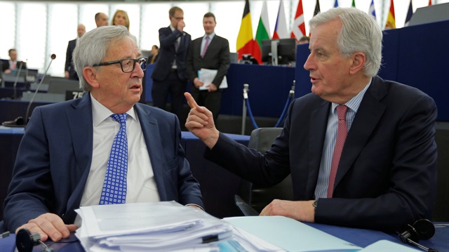 European Union's Chief Brexit negotiator Barnier talks with European Commission President Juncker ahead of a debate on the guidelines on the framework of future EU-UK relations at the European Parliament in Strasbourg