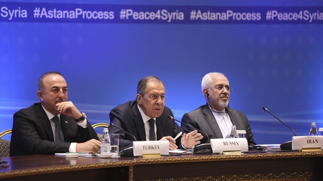 Foreign Ministers, Sergei Lavrov (C) of Russia, Mevlüt Çavuşoğlu (L) of Turkey and Mohammad Javad Zarif of Iran, attend the international meeting on Syria in Astana, Kazakhstan March 16, 2018. 