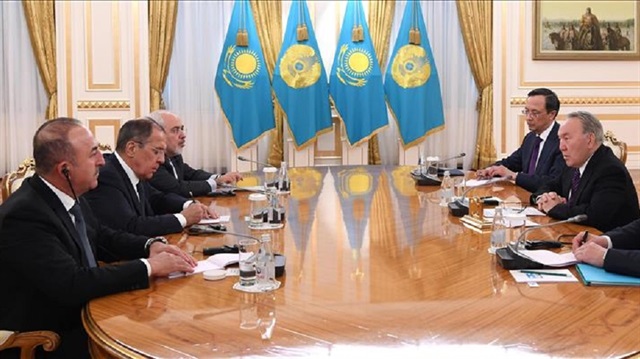 President of Kazakhstan Nursultan Nazarbayev (2nd R) receives Minister of Foreign Affairs of Turkey, Mevlut Cavusoglu (L), Russian Foreign Minister, Sergei Lavrov (2nd L) and Iranian Foreign Minister, Mohammad Javad Zarif (3rd L) at his office after the ninth round of Syria peace talks in Astana, Kazakhstan on March 16, 2018. 