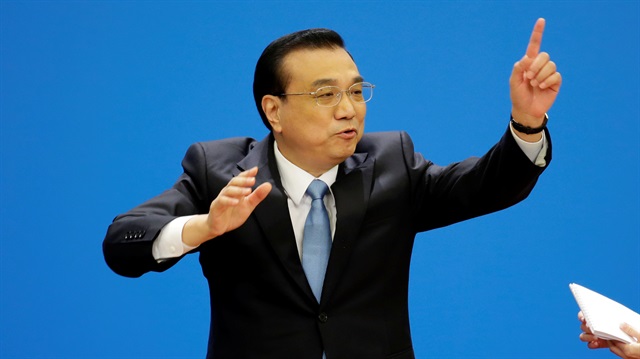 Chinese Premier Li Keqiang gestures as he leaves the news conference following the closing session of the National People's Congress (NPC), at the Great Hall of the People in Beijing, China March 20, 2018. REUTERS/Jason Lee