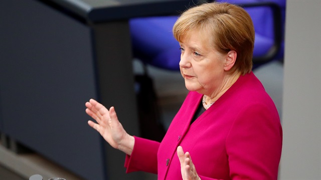 German Chancellor Angela Merkel addresses the lower house o
