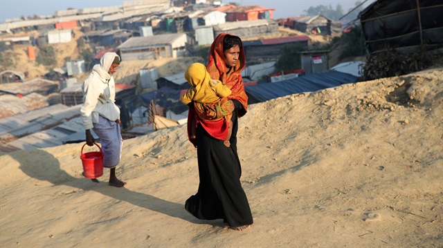 Rohingya refugees walk at Jamtoli camp in the morning in Cox's Bazar