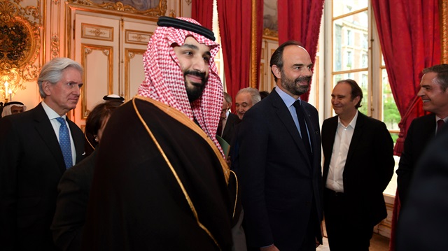 French Prime Minister Edouard Philippe (R) escorts Saudi Arabia's Crown Prince Mohammed bin Salman upon his arrival at the Hotel de Matignon in Paris, France.
